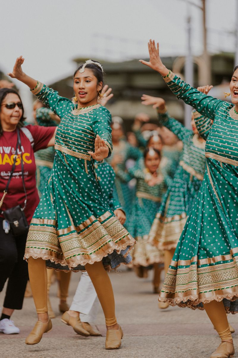 Dancers in green performing in the parade