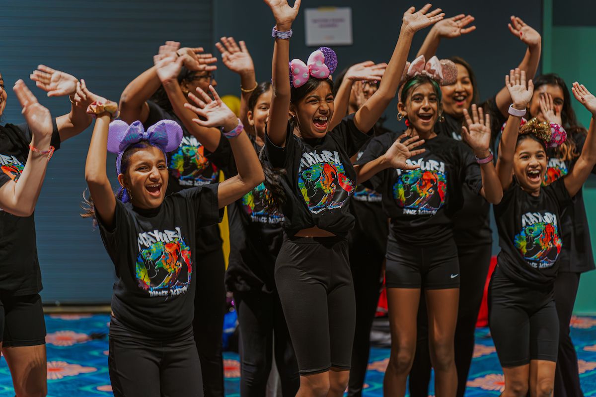 Dancers rehearsing together before the showcase