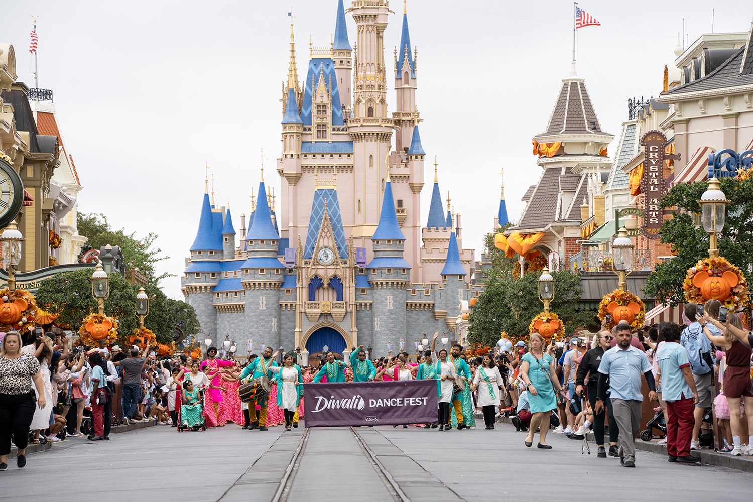 The 2025 Diwali Dance Fest parade on Main Street USA with Cinderella Castle behind